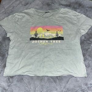 Teal semi-crop top. Worn once. Tag ripped off. Size medium.